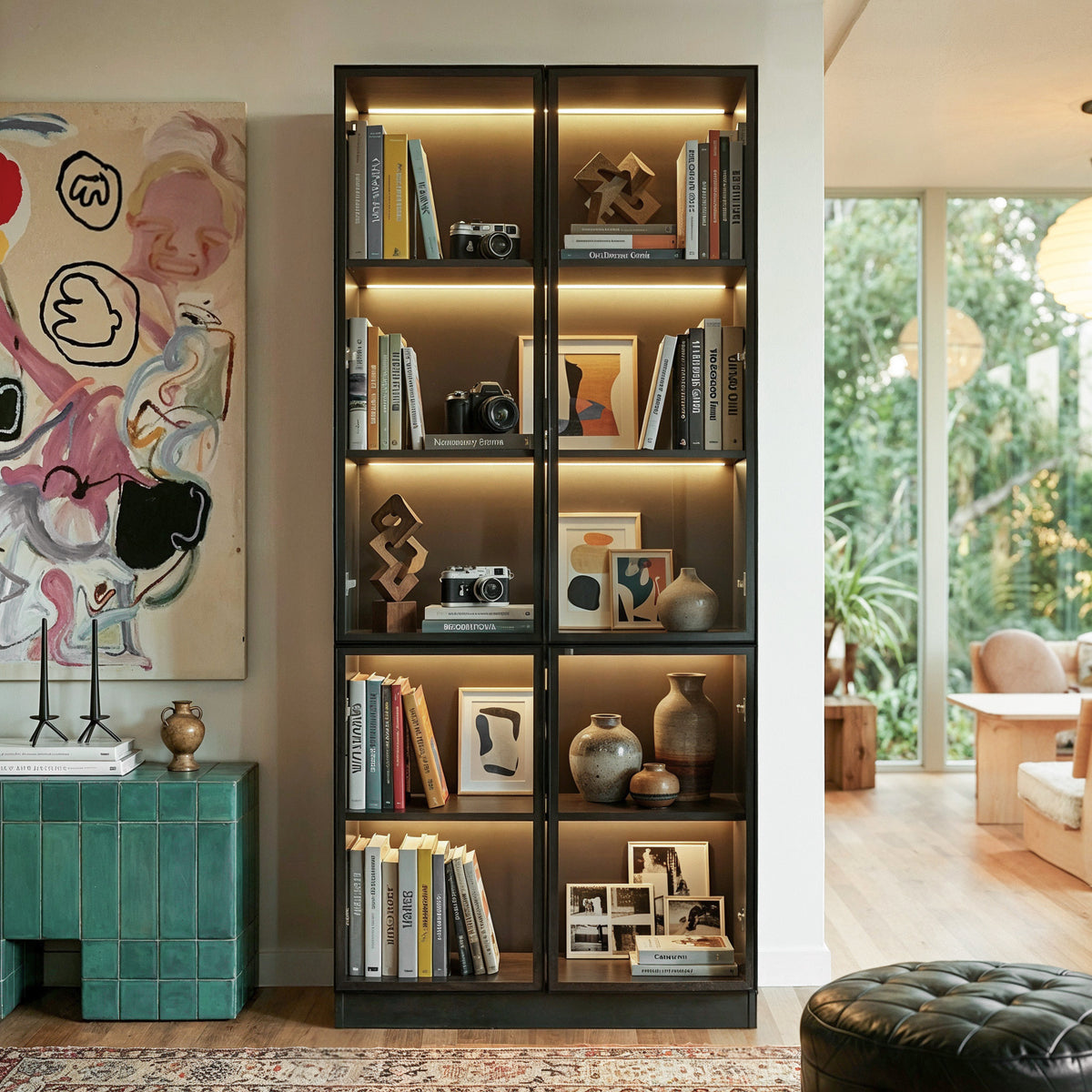 Varda tall display cabinet with five lighted tiers behind tempered glass doors