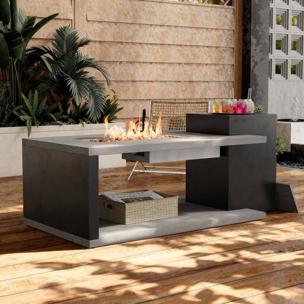 Rectangular propane fire pit table with flames on a wooden deck surrounded by plants