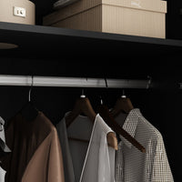Modern wardrobe with clothes and shelves in a well-lit room