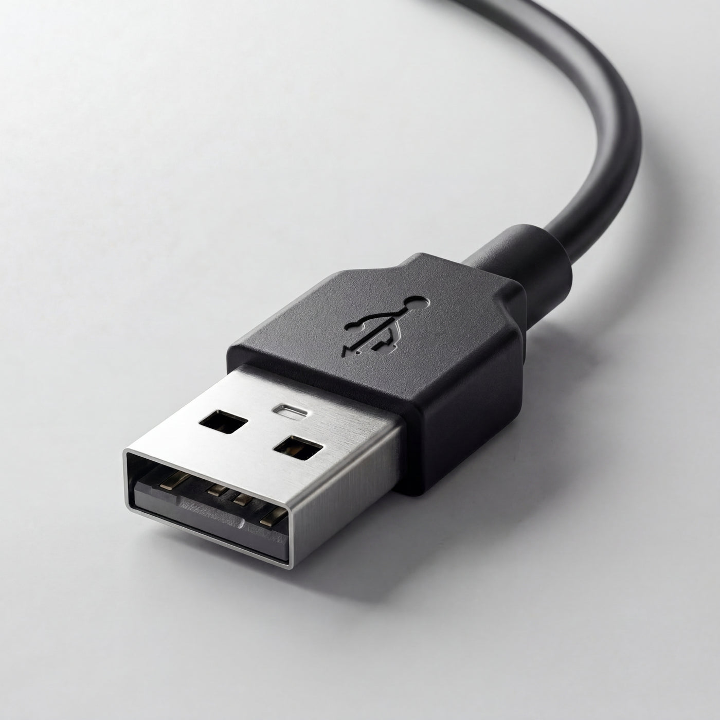 Close-up of a USB cable on a light gray background