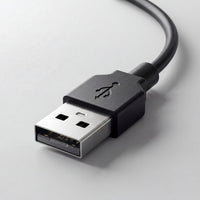 Close-up of a USB cable on a light gray background