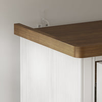Dining room with a white ornate cabinet and wooden table